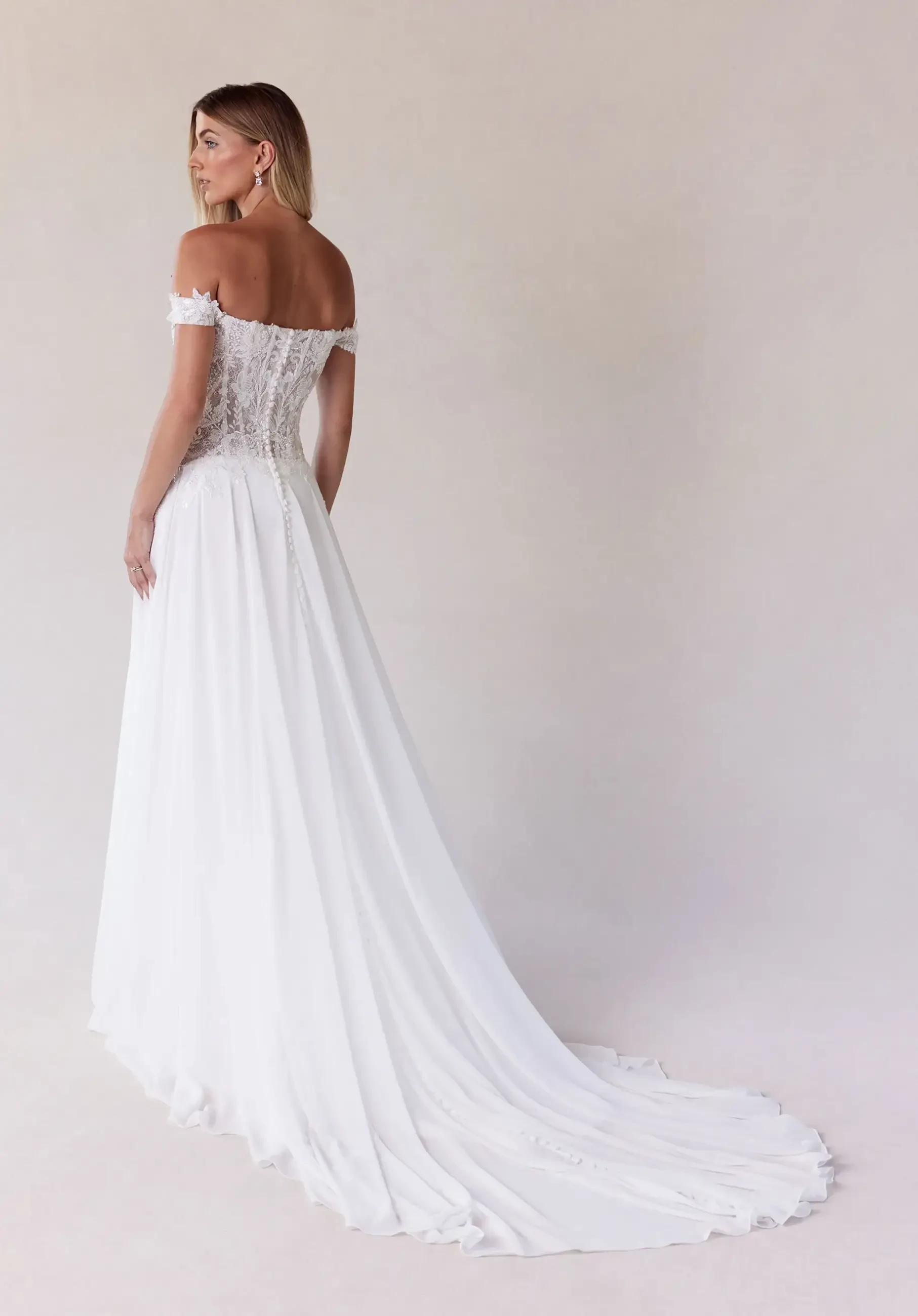 model is wearing an a-line bridal gown by morilee
