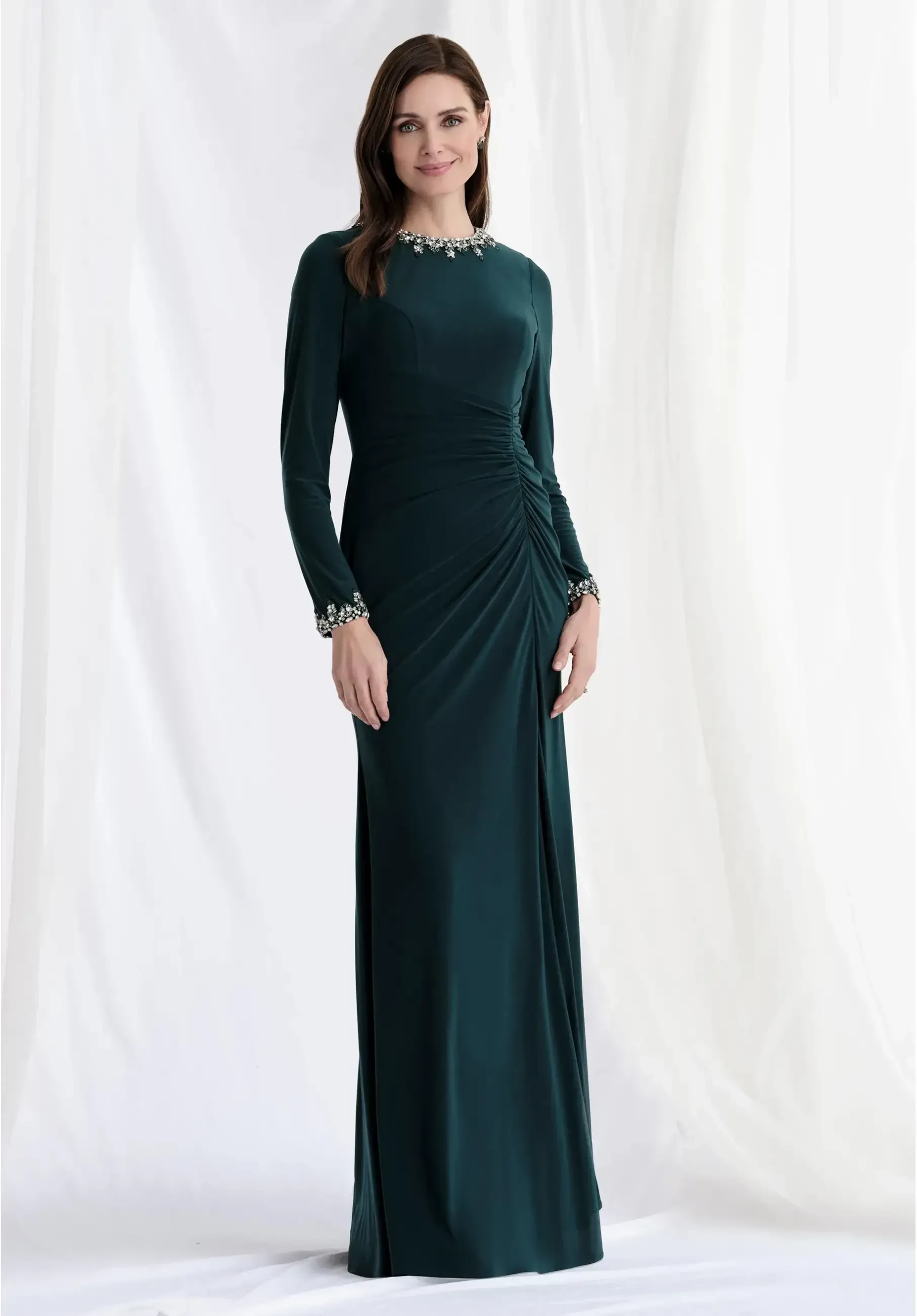 model is wearing a dark green long sleeve scoop neckline mother of the bride dress
