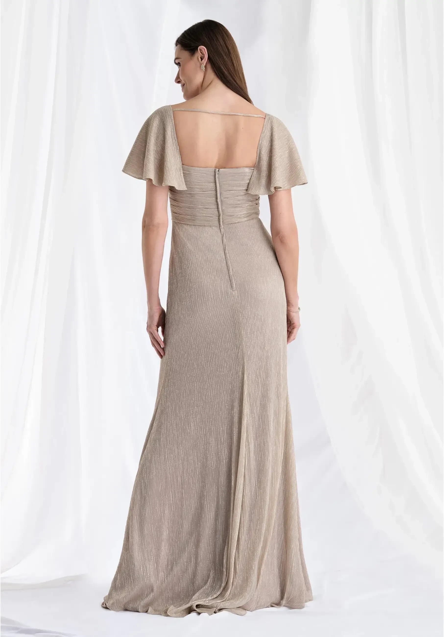 model is wearing a flutter sleeve floor length neutral other of the bride dress