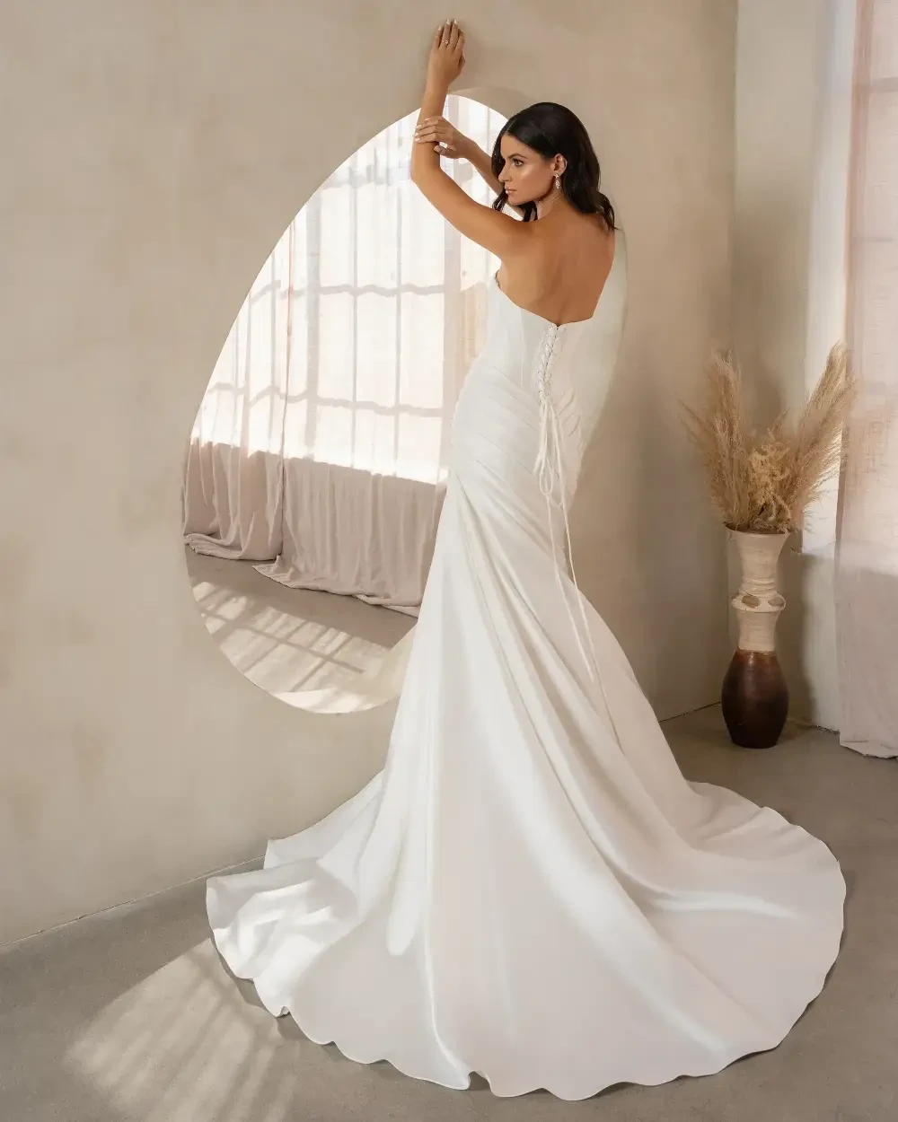 model is wearing a strapless bridal gown