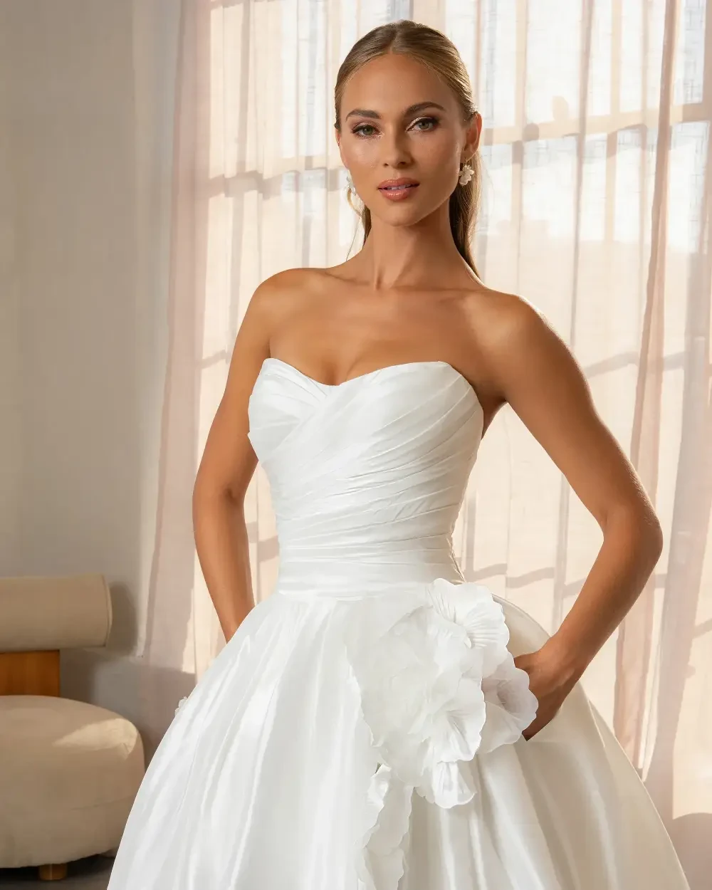 model is wearing a strapless ball gown