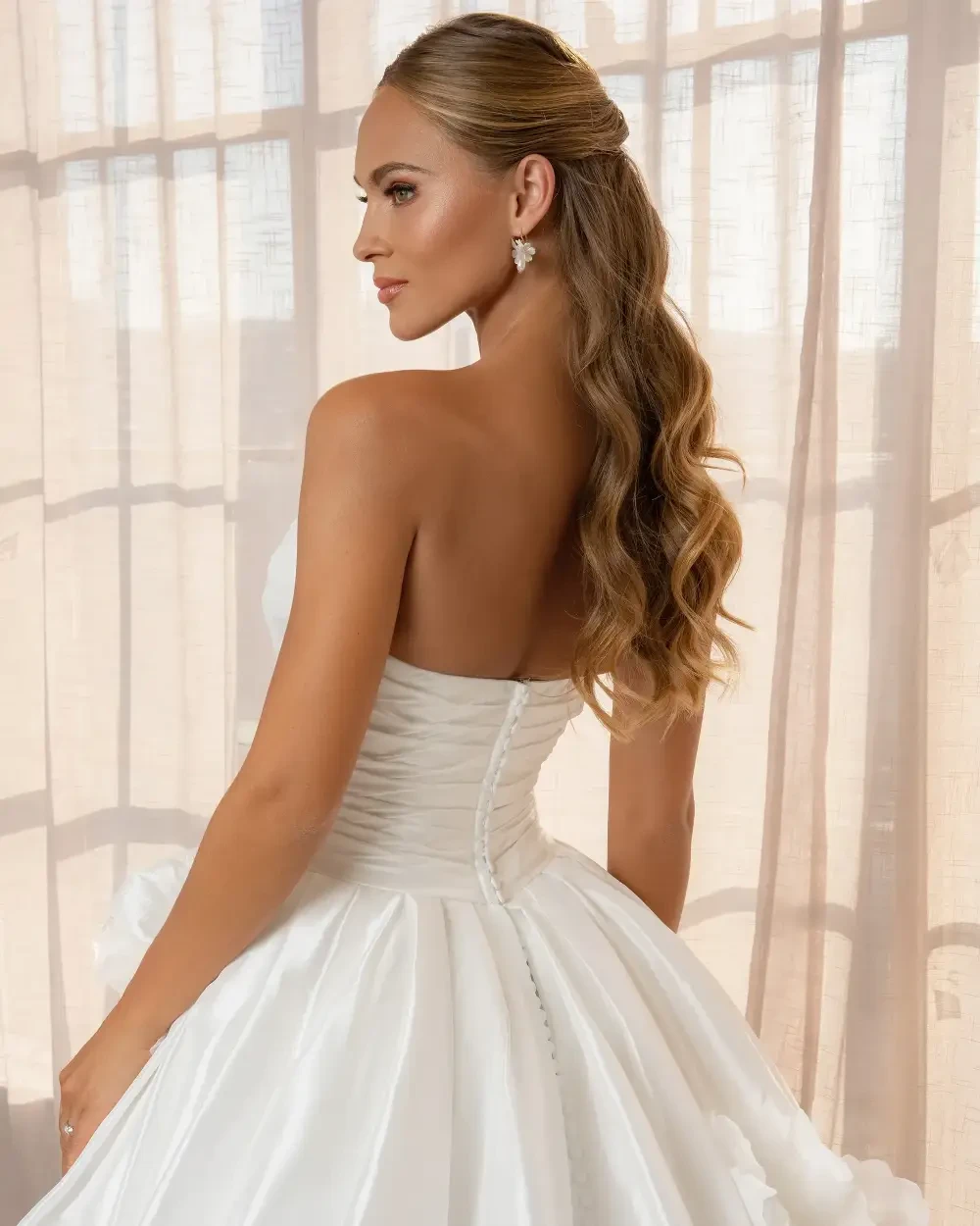 model is wearing a strapless ball gown